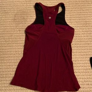 Excellent - like new. Size 4 Lululemon tank with built in light support
